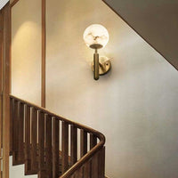 A luxurious Aelios Wall Light on display in a staircase.