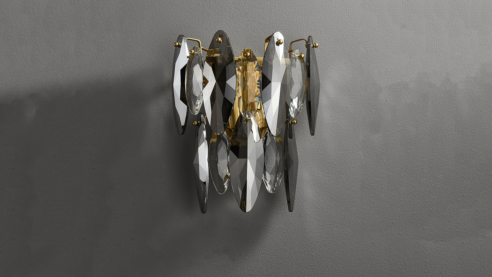 Crescent crystal wall sconce off display.