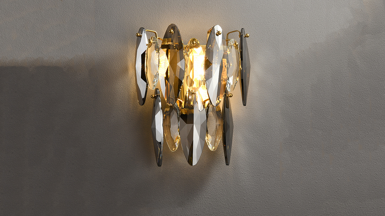 Crescent crystal wall sconce on display.