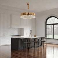 Hera Crystal crystal round chandelier Over the kitchen island with 3 chairs.