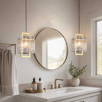 Hestia crystal small chandelier on display in a modern restroom above the sides of the sink.