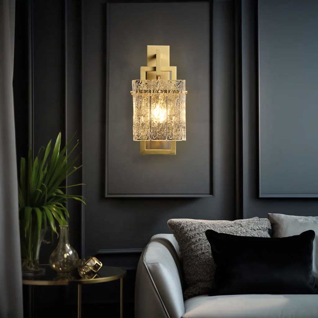 A Hestia crystal wall sconce on display  above sofa in living room.