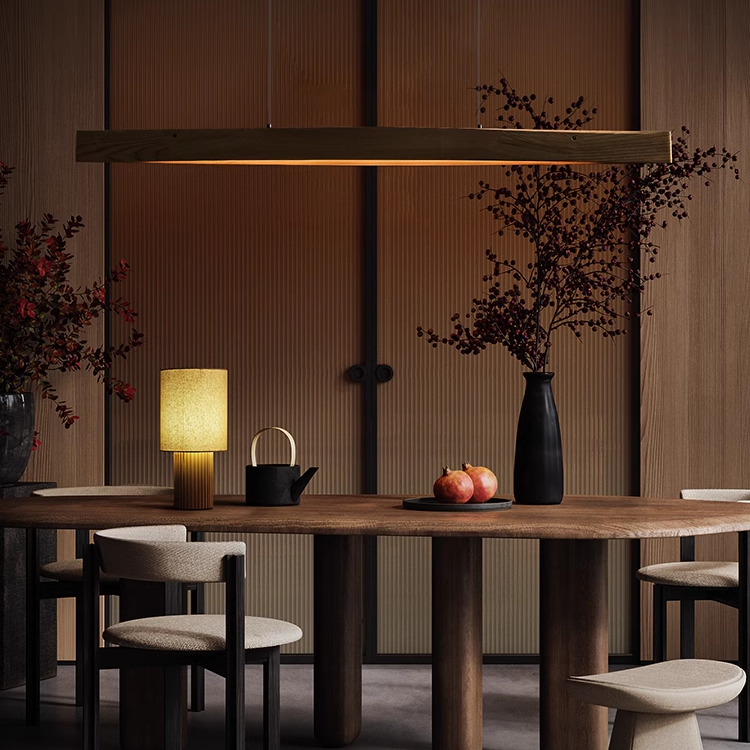 Lris Solid wood Pendant Light in a mid-modern dining room over a wooden table.