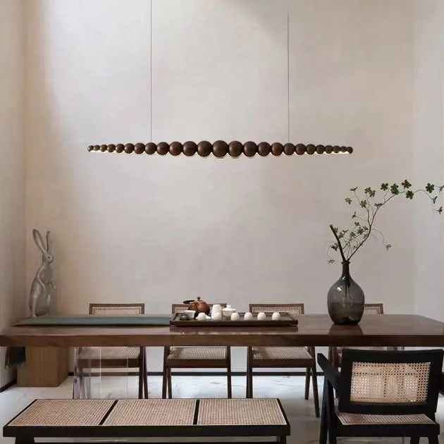 Nimbus black and wood pendant over Chinese dining table.