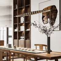 Nimbus wood chandelier above the tea table.